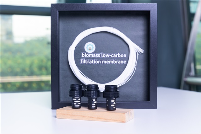 Hollow fiber filtration membrane produced via low-carbon biomass manufacturing processes